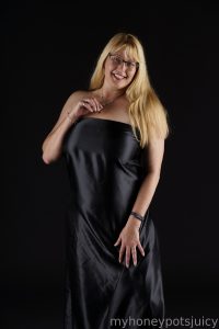 American babe in black silk dress.