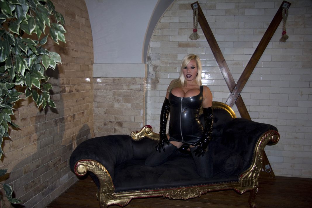 Michelle Thorne in black BDSM outfit