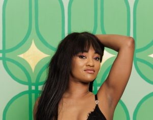 Kartel Kay in all black body suit and stockings