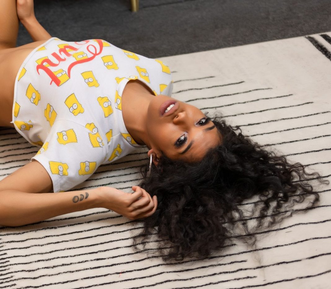 Sabrina Jade lies on her back in cropped t shirt, thong and socks filthy babeshows phone sex