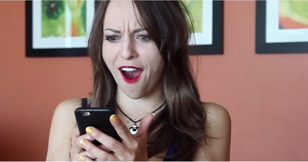 fe935153_edit_img_facebook_post_image_file_15632182_1423684542_DIck-Pic-FB girl looking at phone
